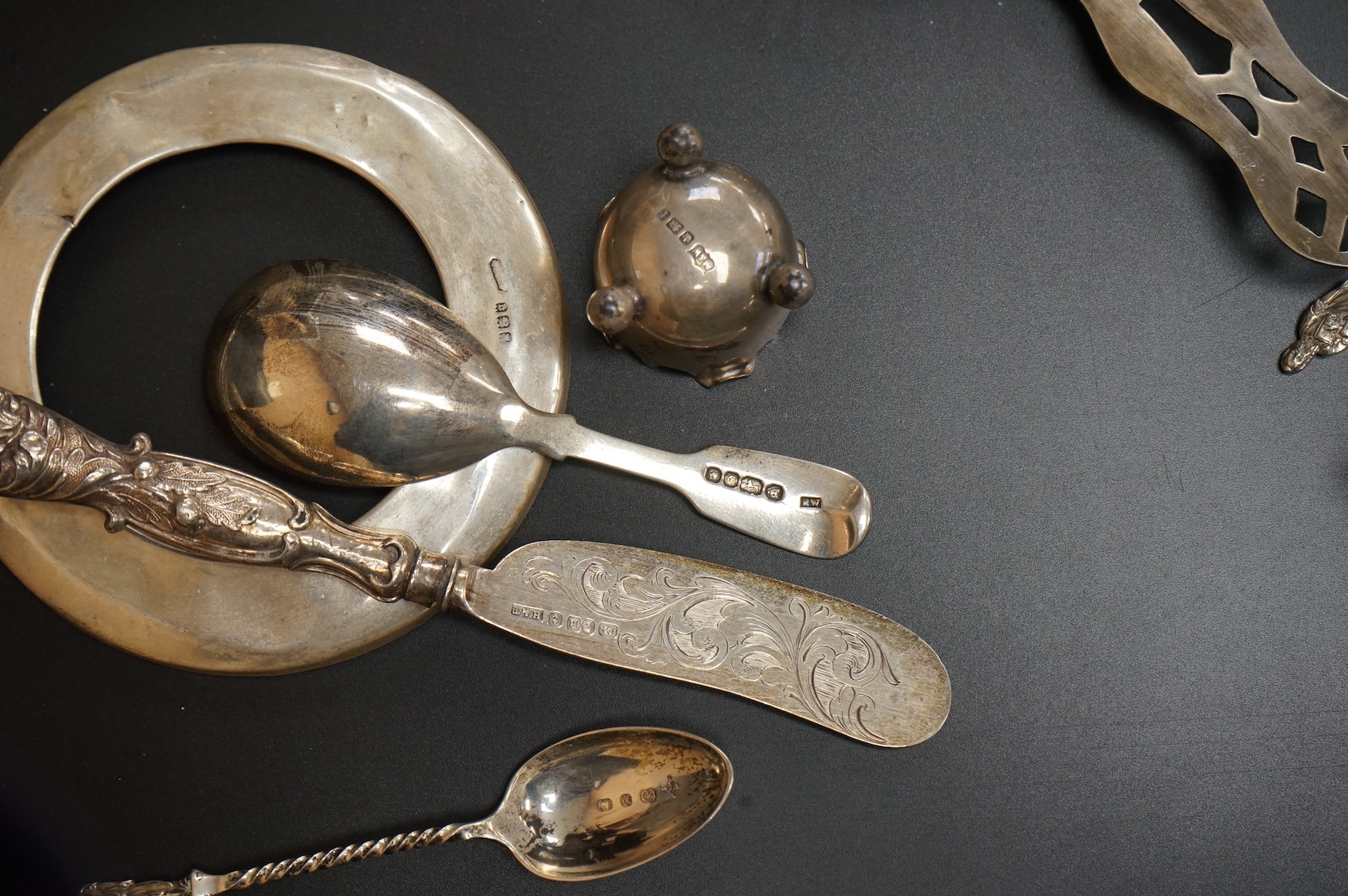 A George V six piece silver condiment set by Mappin & Webb, Birmingham, 1925, two George V silver mounted photograph frames, a small pair of late Victorian silver salts, a silver mounted cut glass dish, a set of six silv